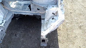 Front left quarter panel of a 2020 Nissan Ariya on a white XGA body