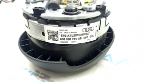 The steering wheel airbag for the driver's side of the Audi A6 C7 12-18 is black and scratched.