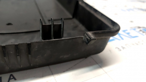 The battery cover latch on a VW Tiguan 2018 is broken.
