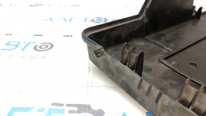 The battery cover latch on a VW Tiguan 2018 is broken.