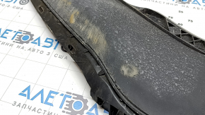 The front bumper lip of the VW Passat b8 16-19 USA is worn out.