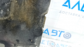 The engine guard of the Audi A6 C7 12-18 is worn and torn.