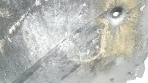 The engine guard of the Audi A6 C7 12-18 is worn and torn.