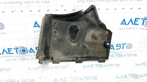 The front left underbody protection of the Audi A6 C7 12-18 is worn and dented.