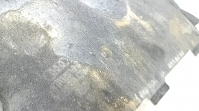 The front left underbody protection of the Audi A6 C7 12-18 is worn and dented.