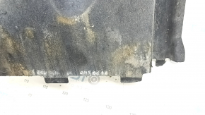 The front left underbody protection of the Audi A6 C7 12-18 is worn and dented.