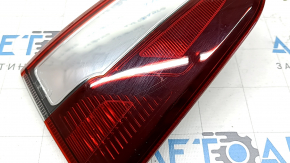 The left inner tailgate light for a Ford Ecosport 18-22 is dark, scratched, and the mount is broken.