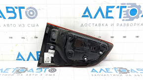 The right inner tailgate light for a Ford Ecosport 18-22 is dark and scratched.