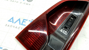 The right inner tailgate light for a Ford Ecosport 18-22 is dark and scratched.