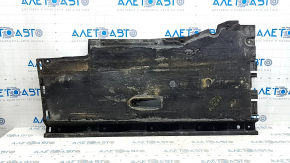 The right underbody protection of the Audi A6 C7 12-18 is worn and torn.