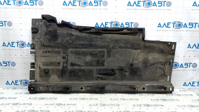 The right underbody protection of the Audi A6 C7 12-18 is worn and torn.