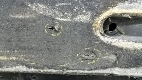 The right underbody protection of the Audi A6 C7 12-18 is worn and torn.