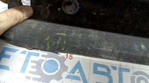 The right underbody protection of the Audi A6 C7 12-18 is worn and torn.