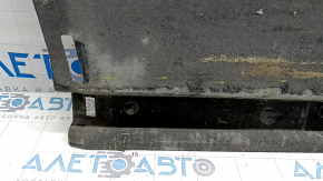 The right underbody protection of the Audi A6 C7 12-18 is worn and torn.