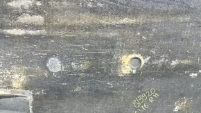 The right underbody protection of the Audi A6 C7 12-18 is worn and torn.