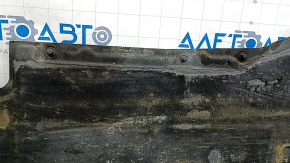 The right underbody protection of the Audi A6 C7 12-18 is worn and torn.