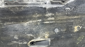 The right underbody protection of the Audi A6 C7 12-18 is worn and torn.