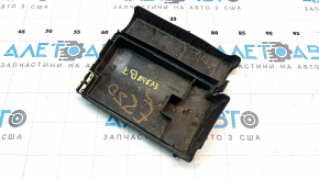 The underhood fuse box cover for a VW Passat B7 12-15 USA has a broken mount.