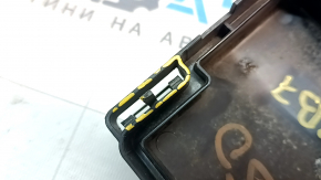 The underhood fuse box cover for a VW Passat B7 12-15 USA has a broken mount.