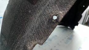 The rear right fender liner of a Mercedes GLC 16-22 has a torn fastener and tears in the fasteners.