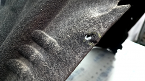 The rear right fender liner of a Mercedes GLC 16-22 has a torn fastener and tears in the fasteners.