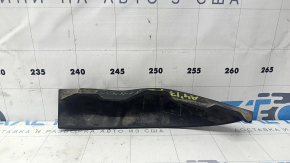 The left front bumper mudguard of an Audi A4 B9 17-25 is worn and scratched.
