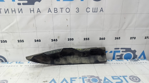 The right front bumper mudguard of an Audi A4 B9 17-25 is worn and scratched.