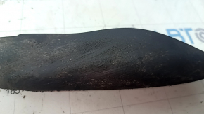 The right front bumper mudguard of an Audi A4 B9 17-25 is worn and scratched.