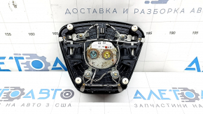 Black steering wheel airbag for the driver's side of a Ford Escape MK4 20-25, with a dented emblem.