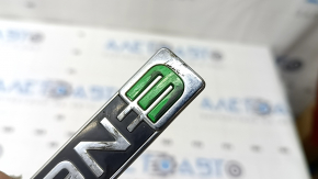 The ENERGI emblem on the front left door of a Ford Fusion mk5 13-20 is worn out.