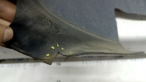 The front left fender liner of a Ford Fusion mk5 17-20 is torn.