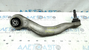 The lower front left control arm of a BMW 5 G30 17-23 RWD has a torn silent block.