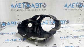The steering column frame assembly for a Jeep Compass 17-18 is black, cracked, and the mounting is broken.