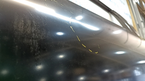 The front left door of a Toyota Prius 50 is bare, 19-22 dents.
