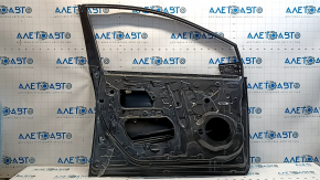 The front left door of a Toyota Prius 50 is bare, 19-22 dents.