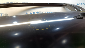 The front left door of a Toyota Prius 50 19-22 is bare and dented.