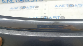 Jeep Compass 22-25 tailgate trim panel under glass with chrome molding, scratches on the molding