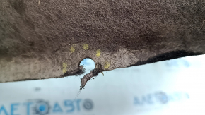 The rear right fender liner of a 2021-23 Ford Mustang Mach-E has a torn mount.