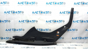 The right underhood trunk trim of the 2021-23 Ford Mustang Mach-E is worn.