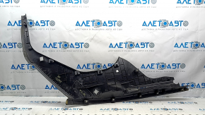 The right underhood trunk trim of the 2021-23 Ford Mustang Mach-E is worn.