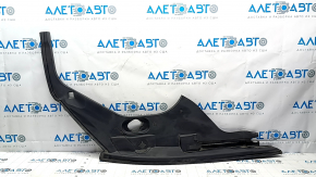 The left underhood trunk trim of the 2021-23 Ford Mustang Mach-E is worn.
