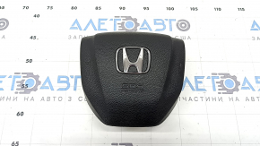 The Honda CRV 17-18 driver's steering wheel airbag is black and has a rusty squib.