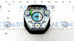 The Honda CRV 17-18 driver's steering wheel airbag is black and has a rusty squib.
