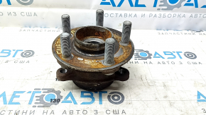 The rear left hub of a 2021-23 Ford Mustang Mach-E is rusty.