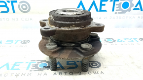 The rear left hub of a 2021-23 Ford Mustang Mach-E is rusty.