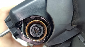 The driver's left knee airbag for the Ford Escape MK3 13-19 is black and has a torn cover.