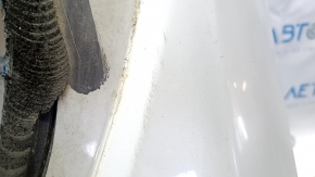 The tailgate is bare, 2013 Ford Mustang Mach-E, white, A3, scratches.