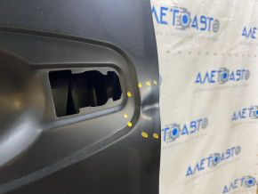 The front left door of a Nissan Rogue 14-20 is bare and dented.