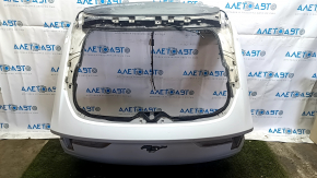 The tailgate is bare, 2013 Ford Mustang Mach-E, white, A3, scratches.