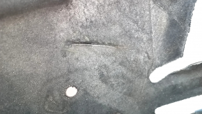 The left underbody protection of a Lincoln MKZ 13-20 is torn.
